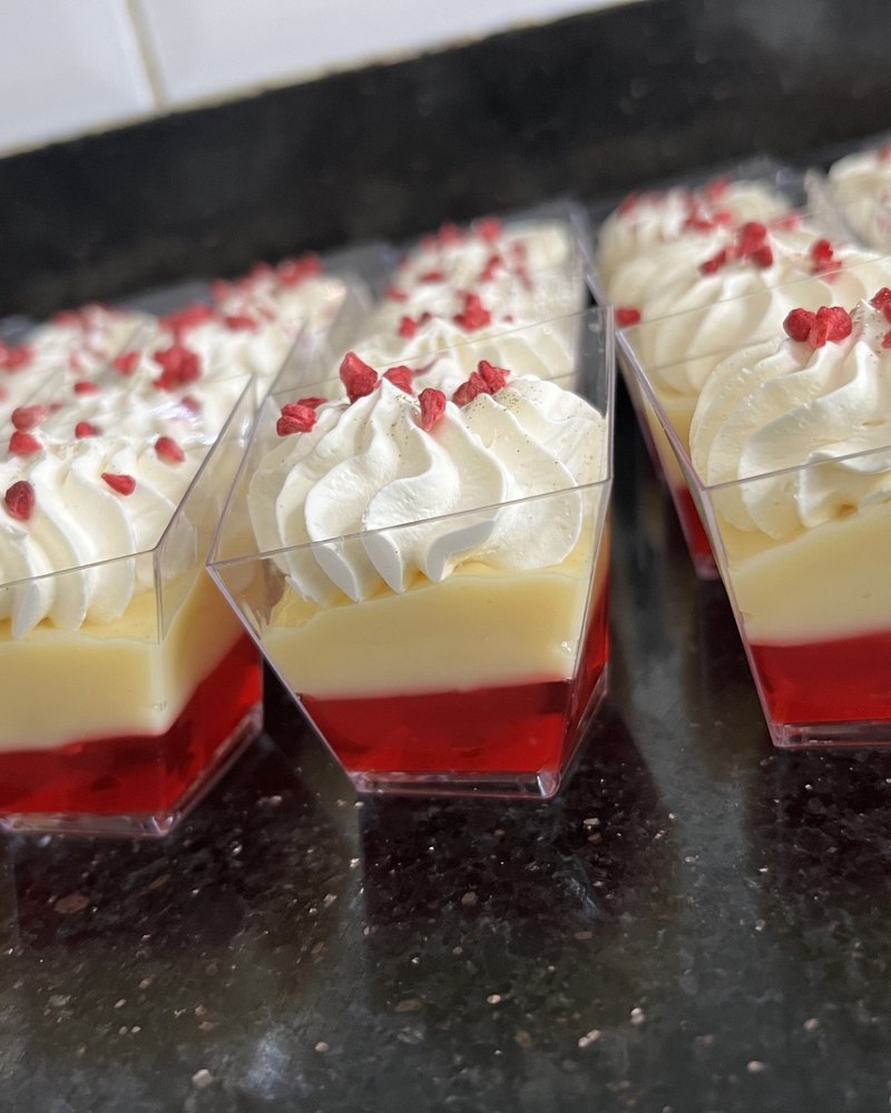 Red velvet jelly trifle cups with vanilla cream and freeze-dried raspberry