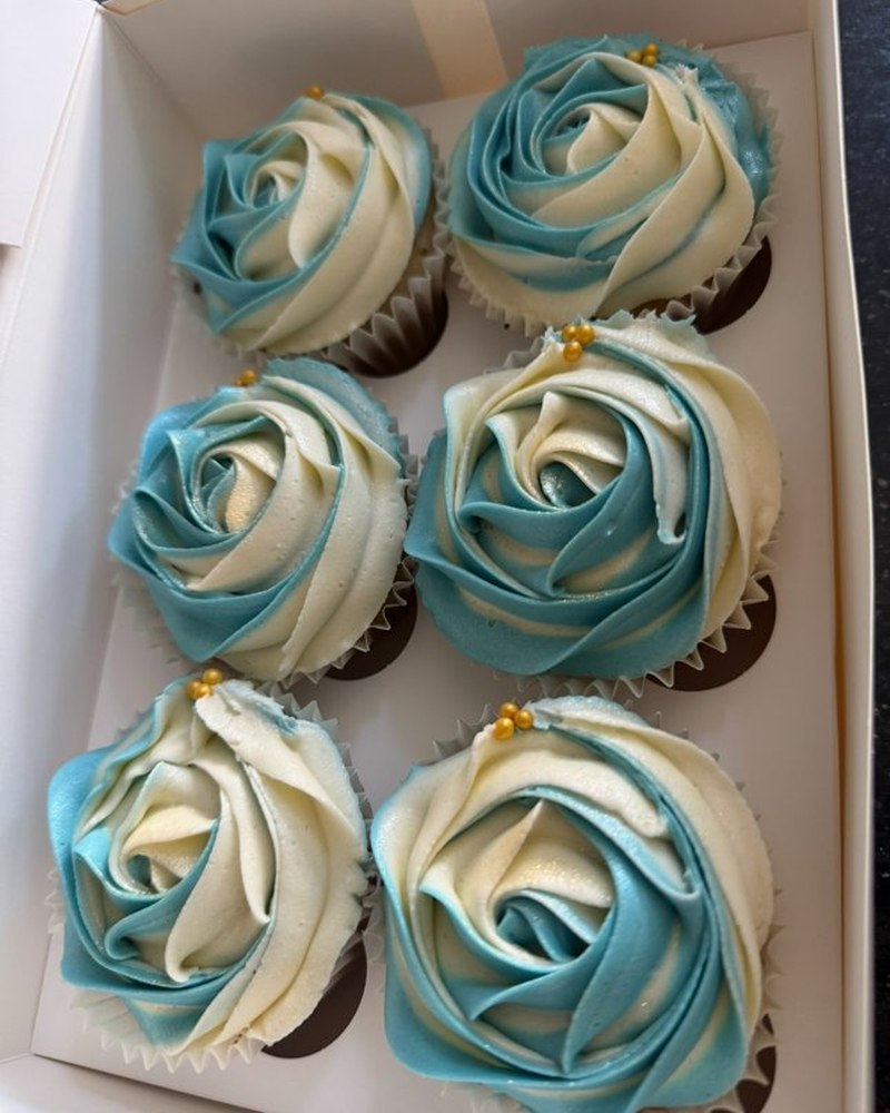 Cupcakes with teal and ivory buttercream roses
