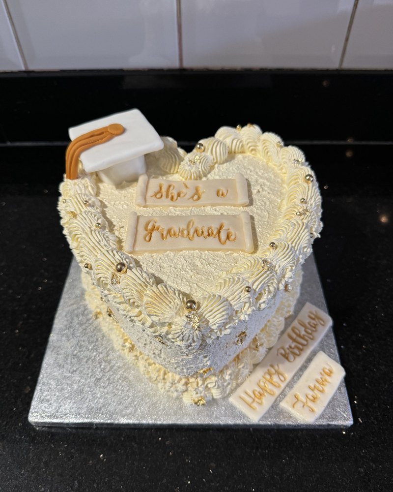 Graduation cap heart cake