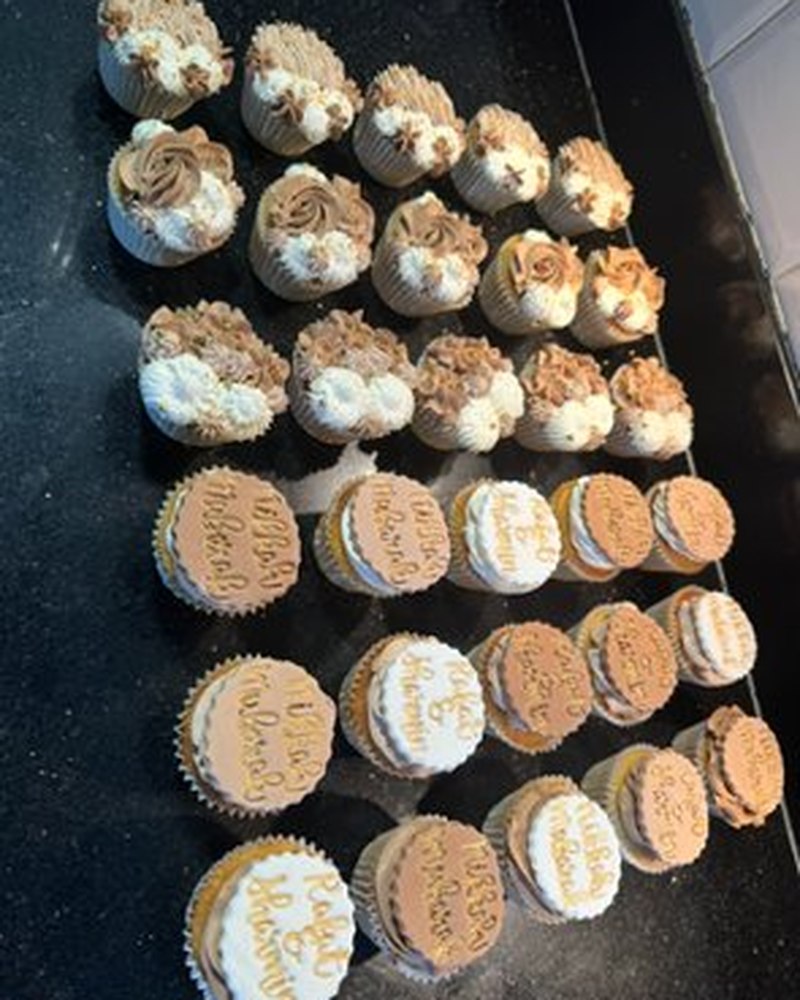 Assorted caramel and vanilla cupcakes with personalised message toppers
