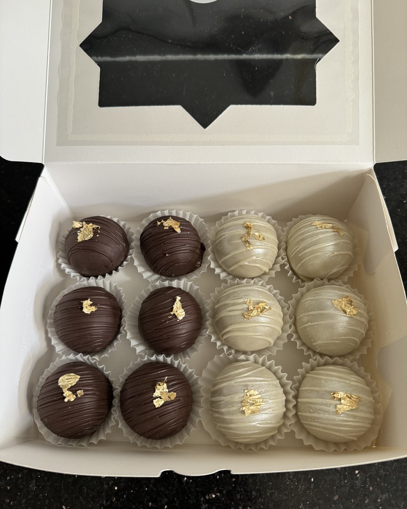Dark and white chocolate truffles with gold leaf
