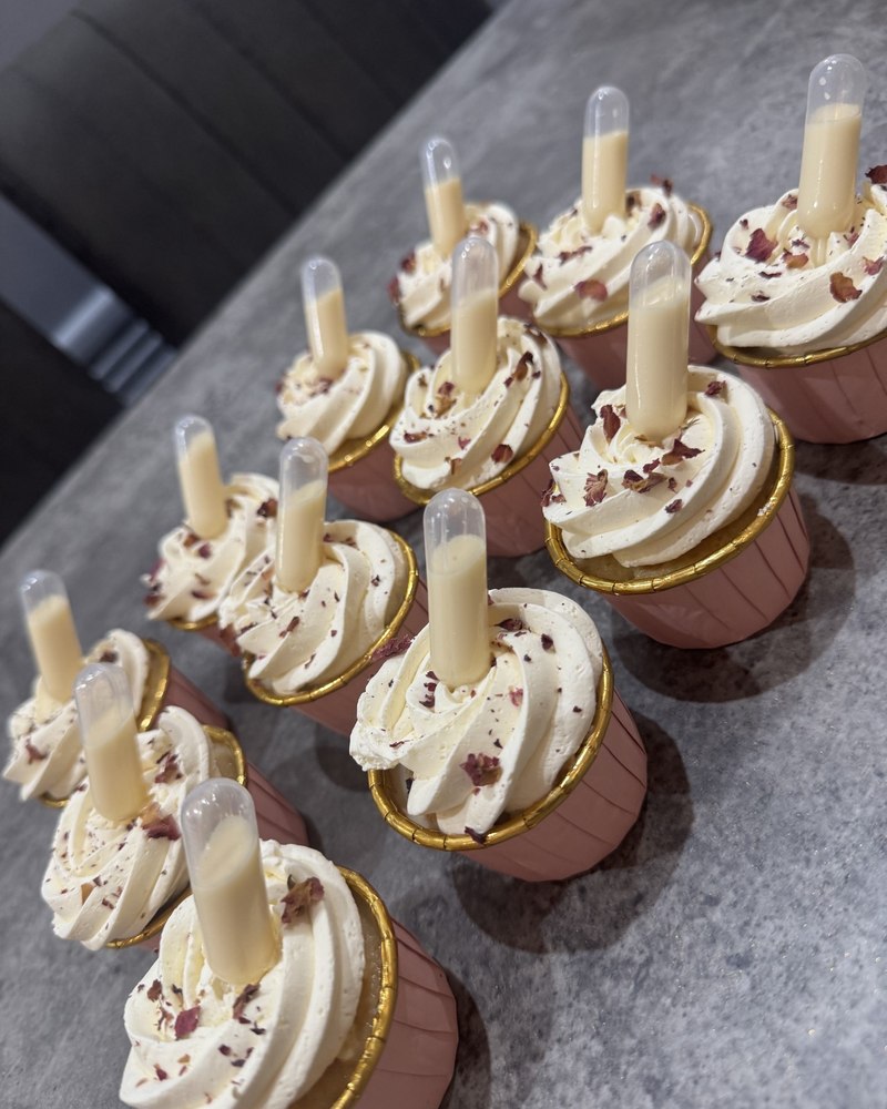 Rose cream cupcakes with white chocolate tubes