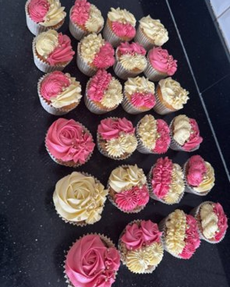 Assorted pink and ivory buttercream cupcakes